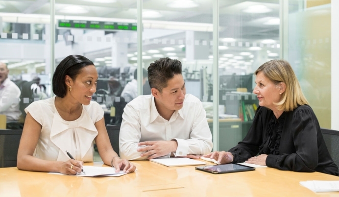 Three people in meeting